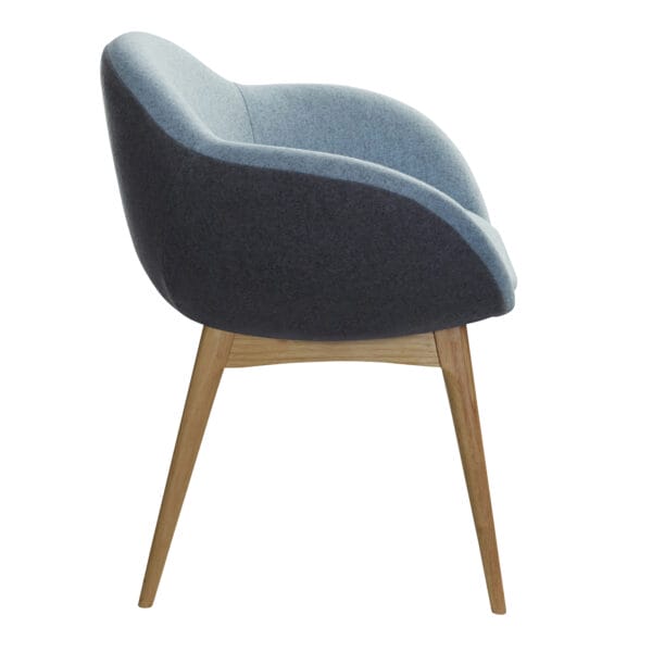 Modern upholstered armchair with a two-tone design and wooden legs.