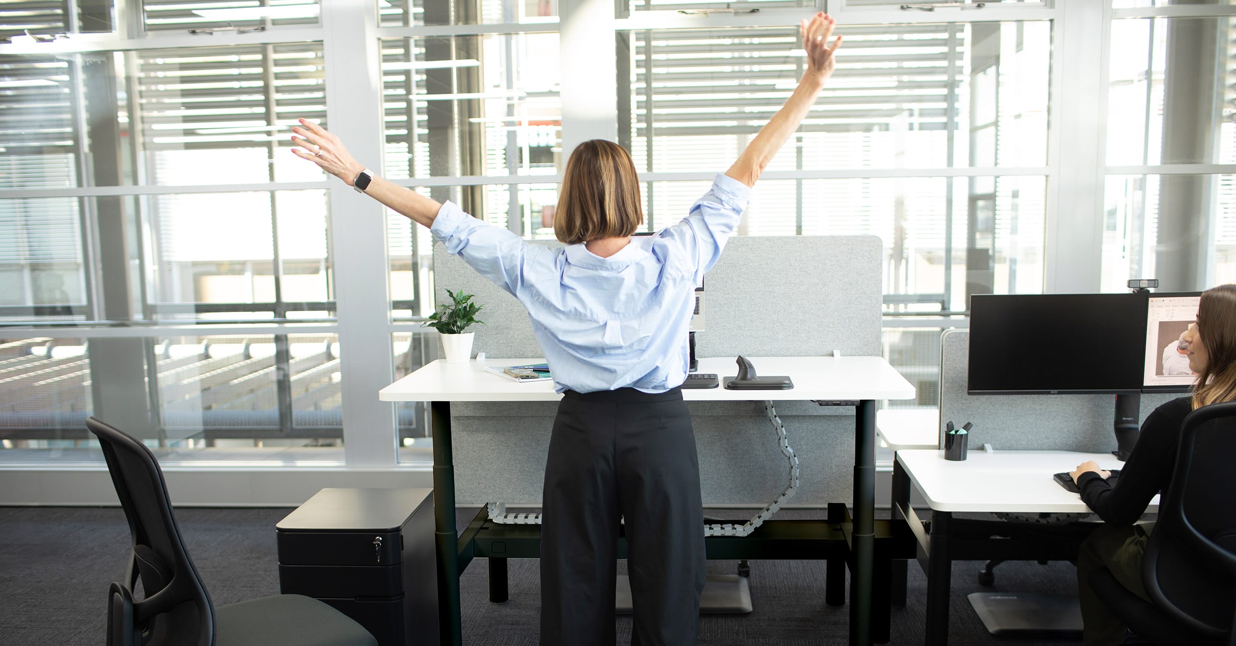 woman stretching at work