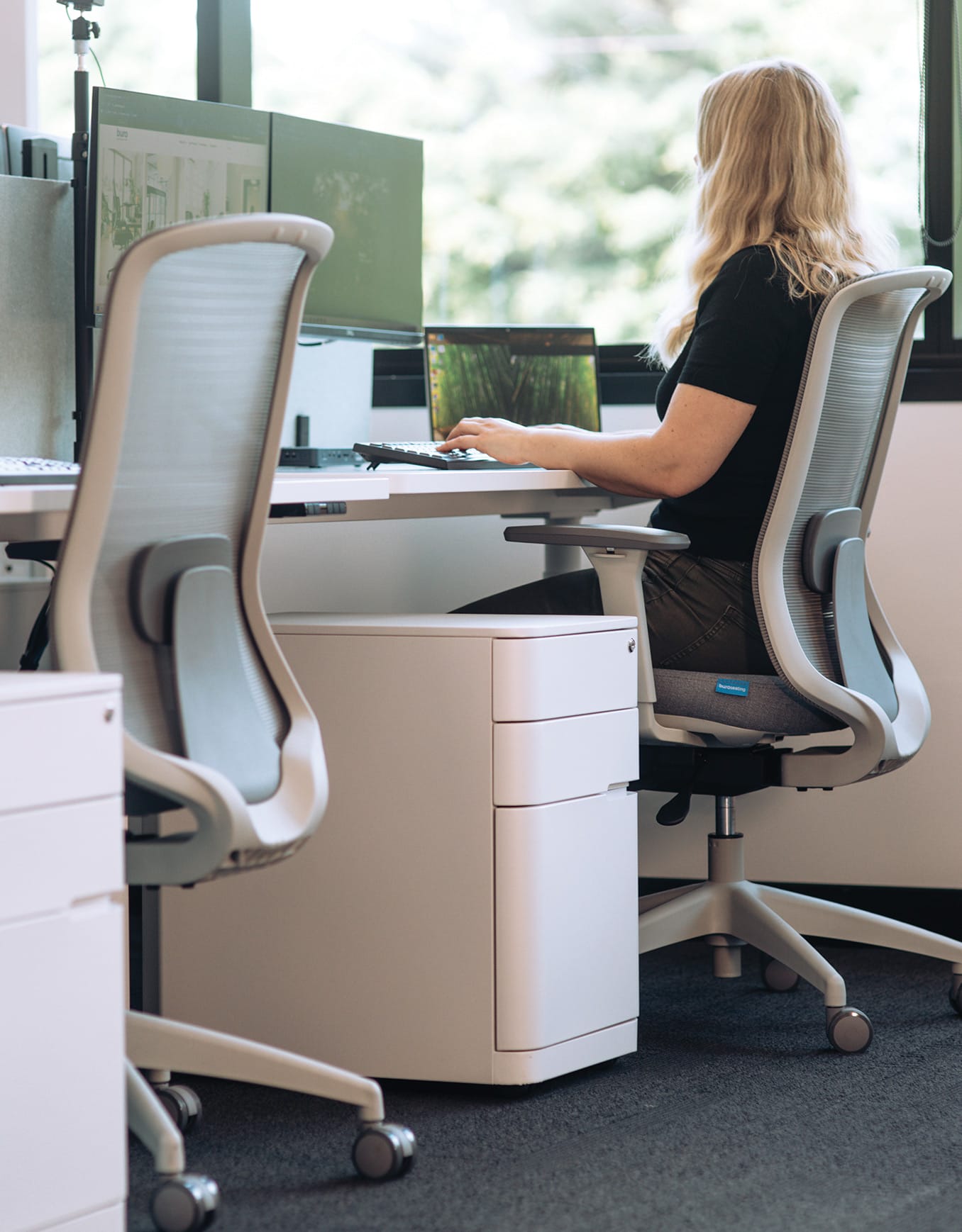 woman working on a standing desk