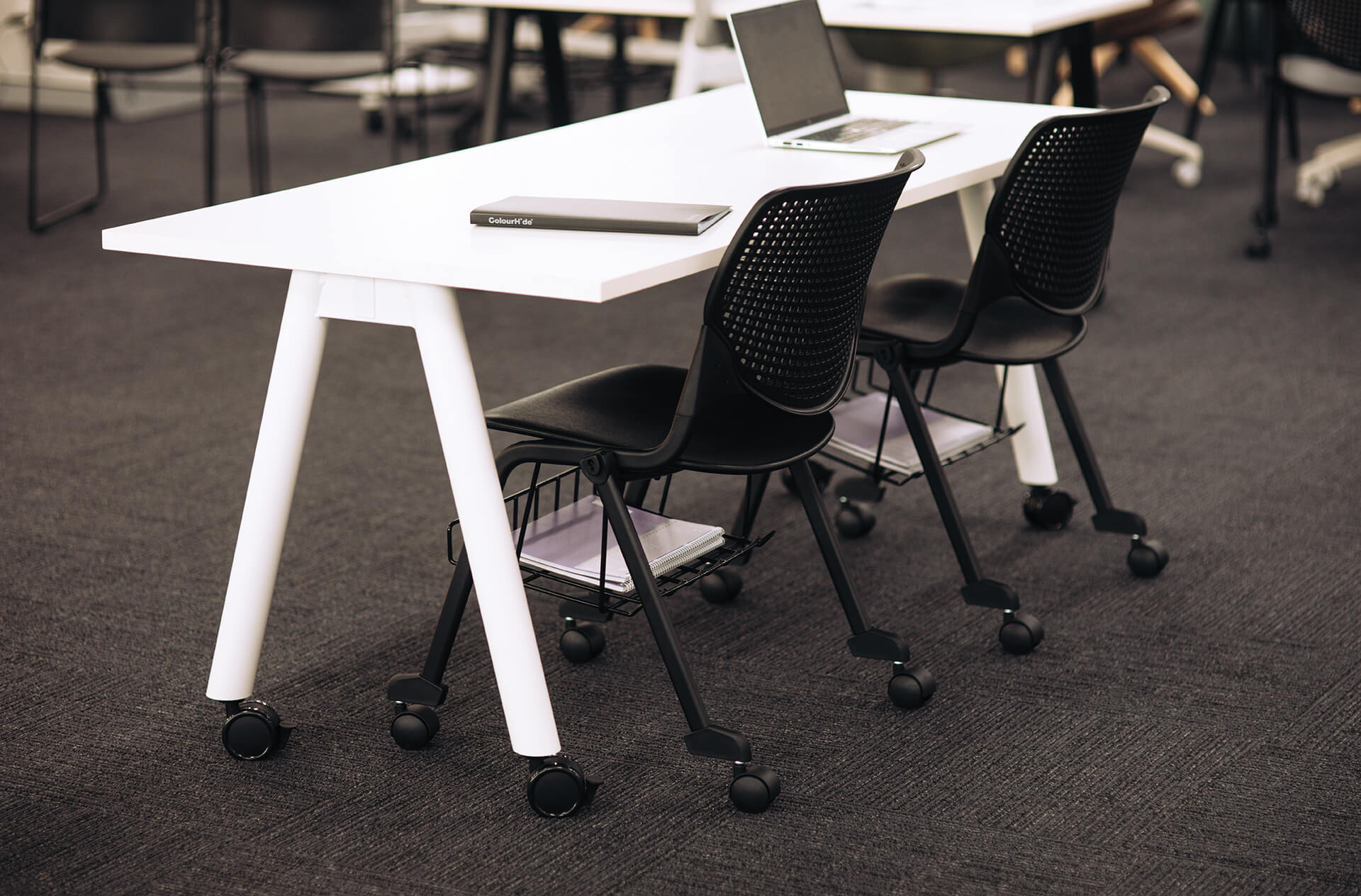 a frame training table with castors scene office