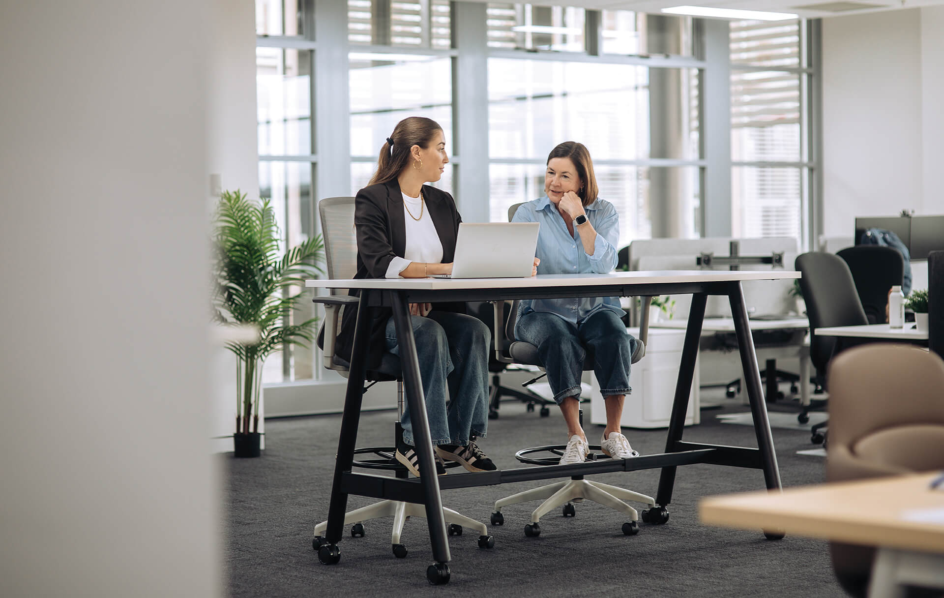 a frame high training table with castors scene office