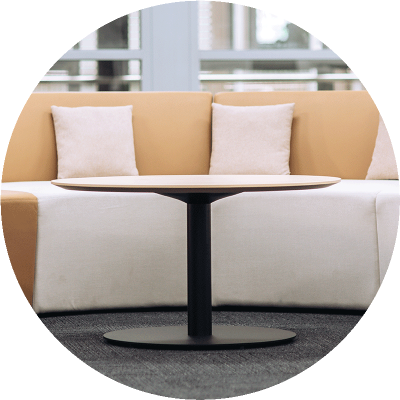 round meeting table in office with soft seating