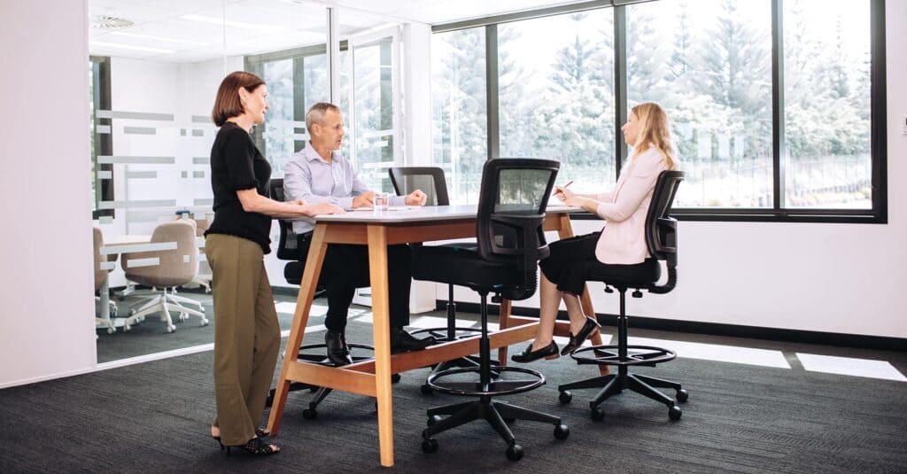 people working in office at high table