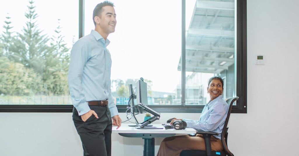 smiling colleagues working in an office