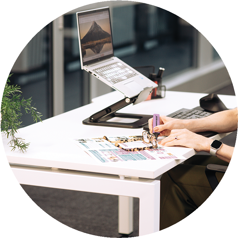 woman working working on white office desk
